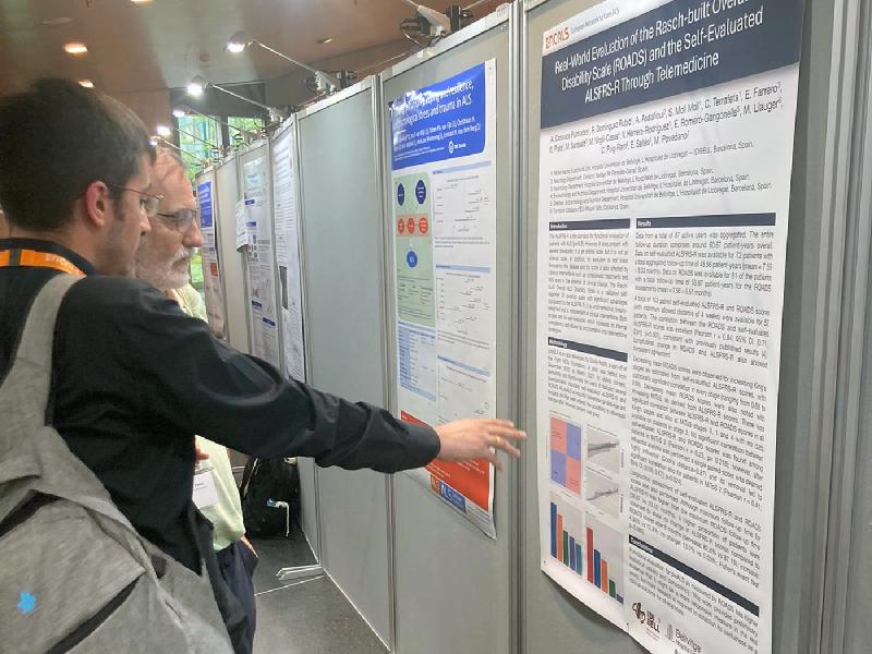Alejandro Caravaca Puchades pointing at his poster during the poster session at the ENCALS Meeting 2024