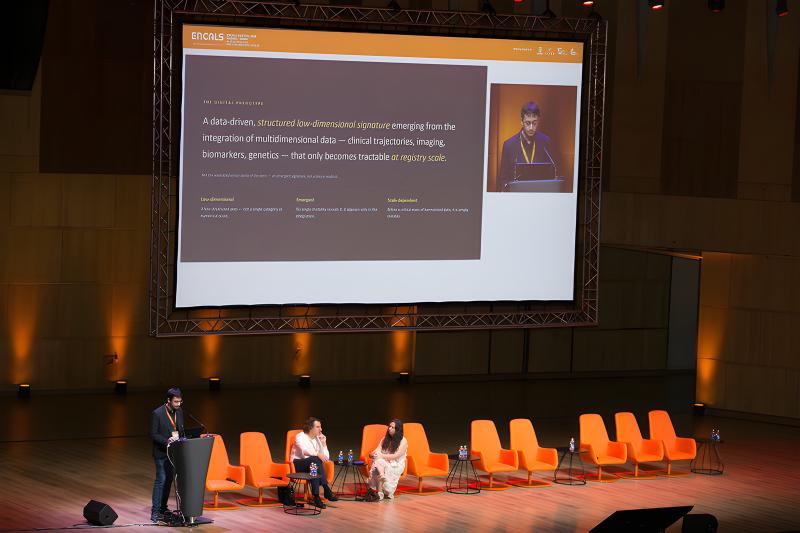 Alejandro Caravaca Puchades presenting the digital-phenotype slide on stage at the ENCALS Meeting 2026